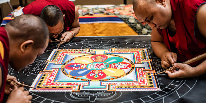 The Tibetan Monks working on the sand mandala, it is about a quarter done