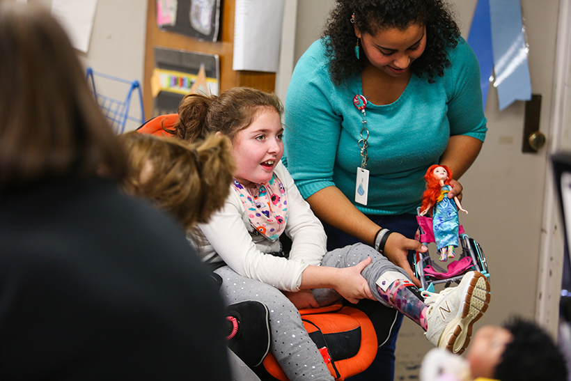 Student in wheelchair shows her princess leg braces