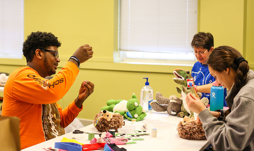 Students and their professor work on toy modifications