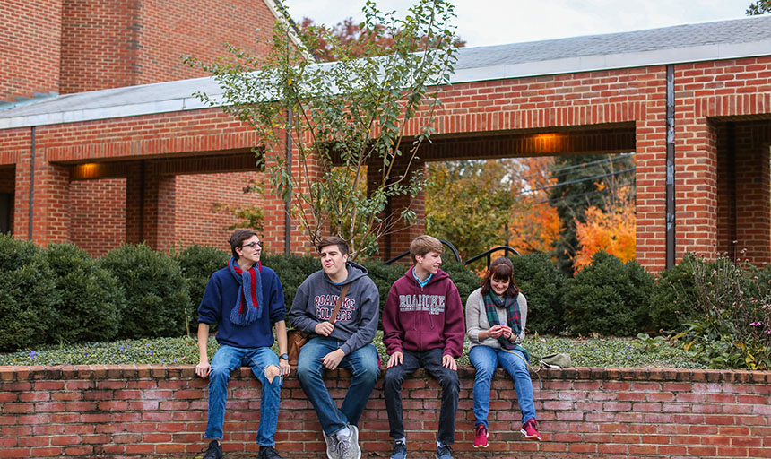 students in front of Tree of 40 fruit 