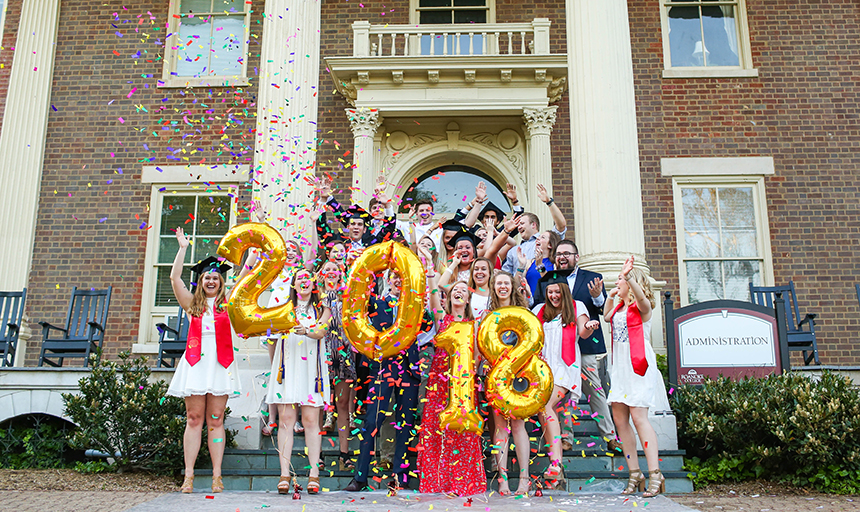 seniors with balloons and commencement