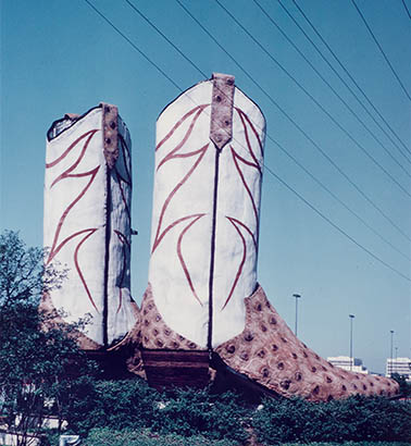 a sculpture of a massive pair of cowboy boots