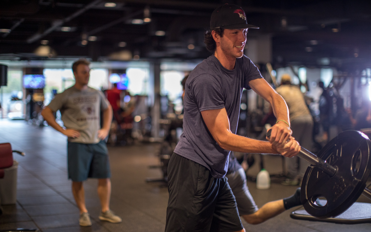 student lifting weights