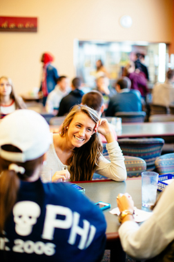 Student smiling in The Commons