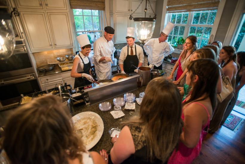 Students cooking with kitchen staff