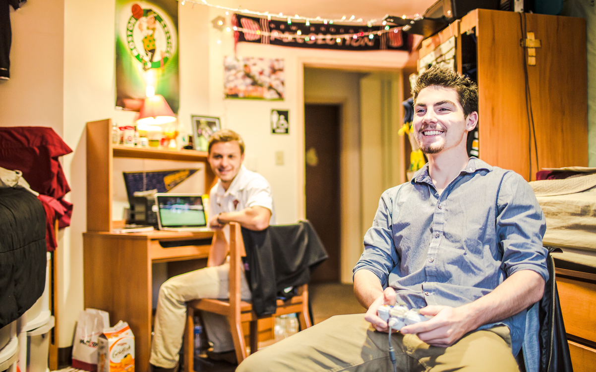Student playing a game in his dorm
