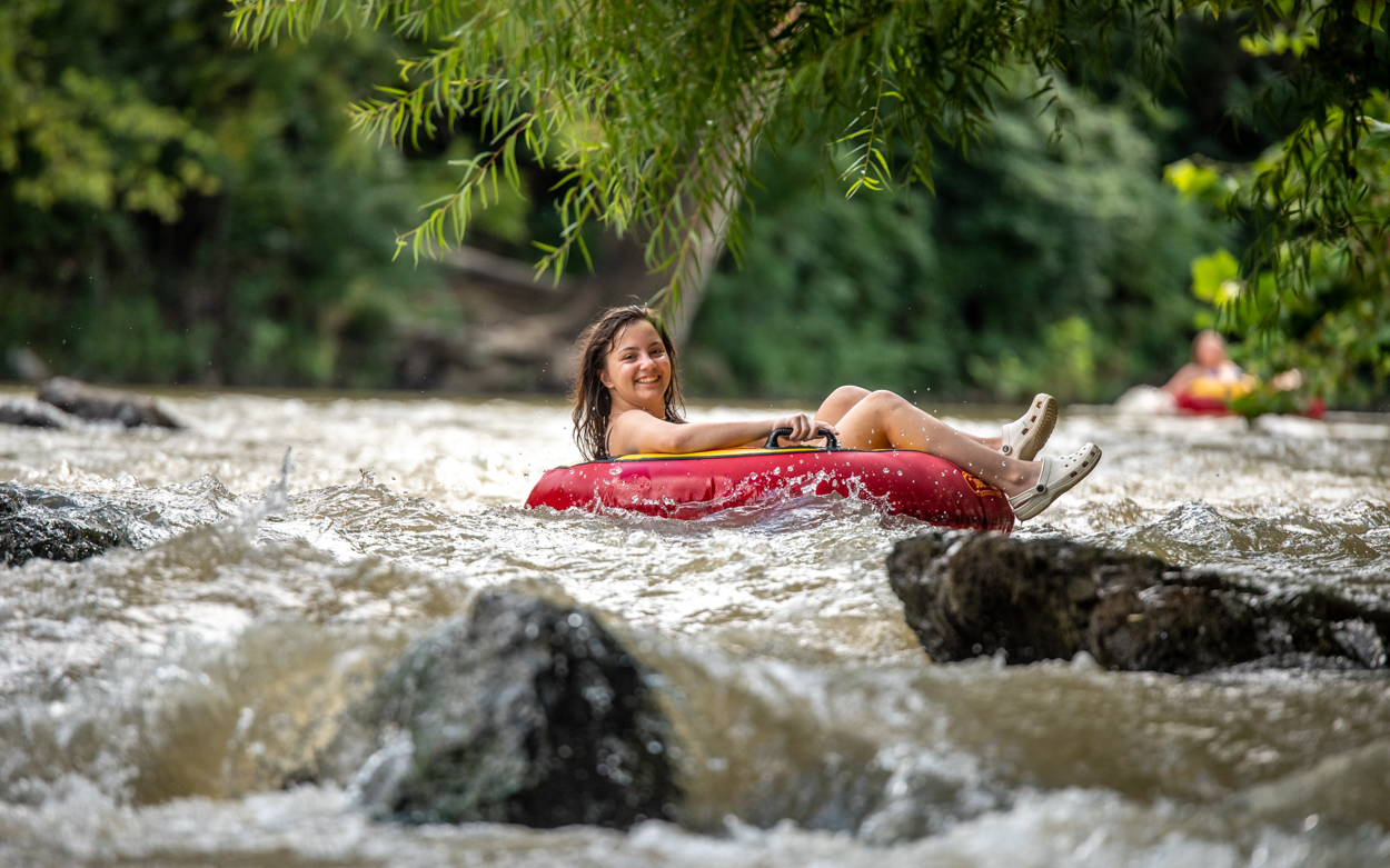 student tubing down the Roanoke River