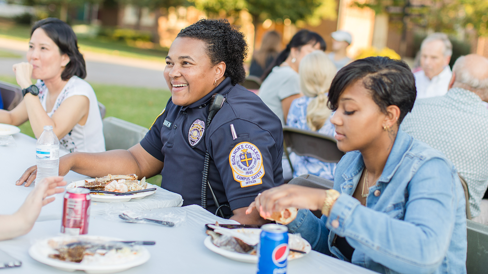 campus safety officer eating dinner with students