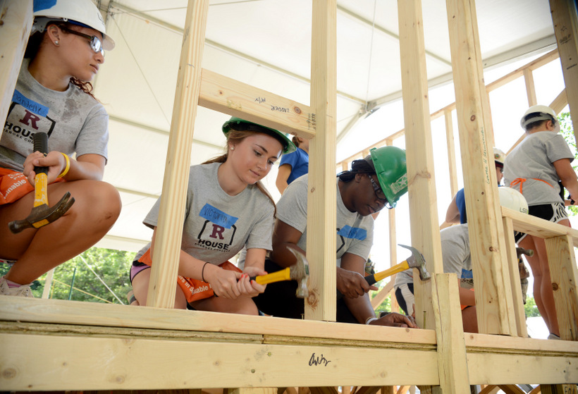 Students working with Habitat for Humanity during orientation