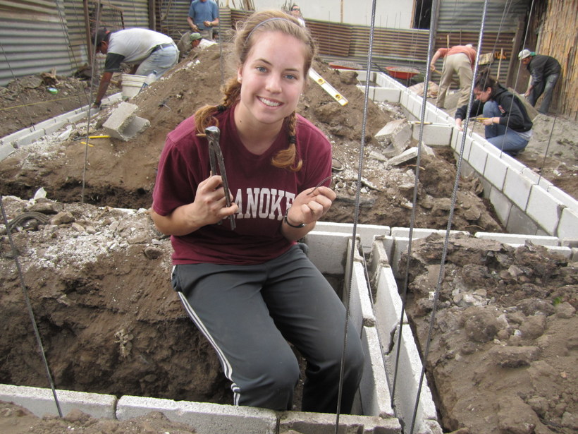 Student working on a house in Guatemala