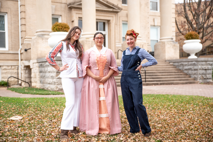 Three people in historic costumes