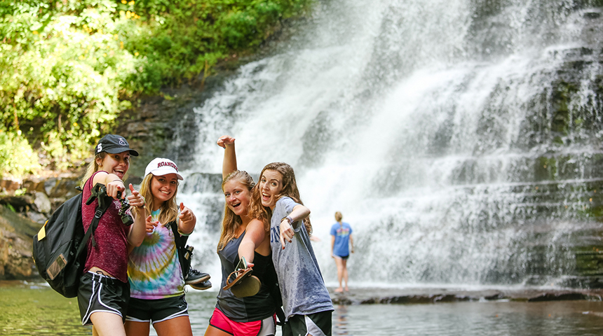 students in front of the Cascades waterfall