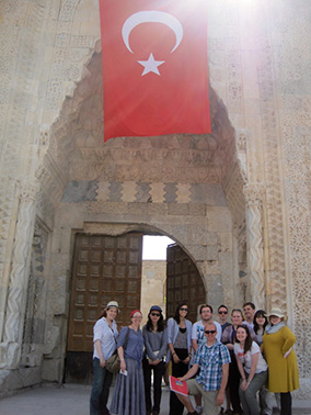 Roanoke students and their professor pose