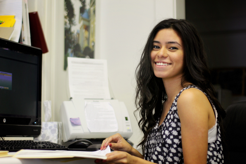Student working in an office on campus