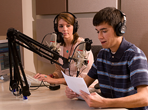 Alumna working with a student during an internship