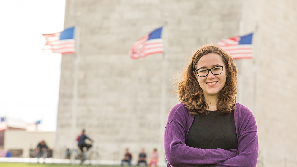 Student in DC in front of Washington Monument