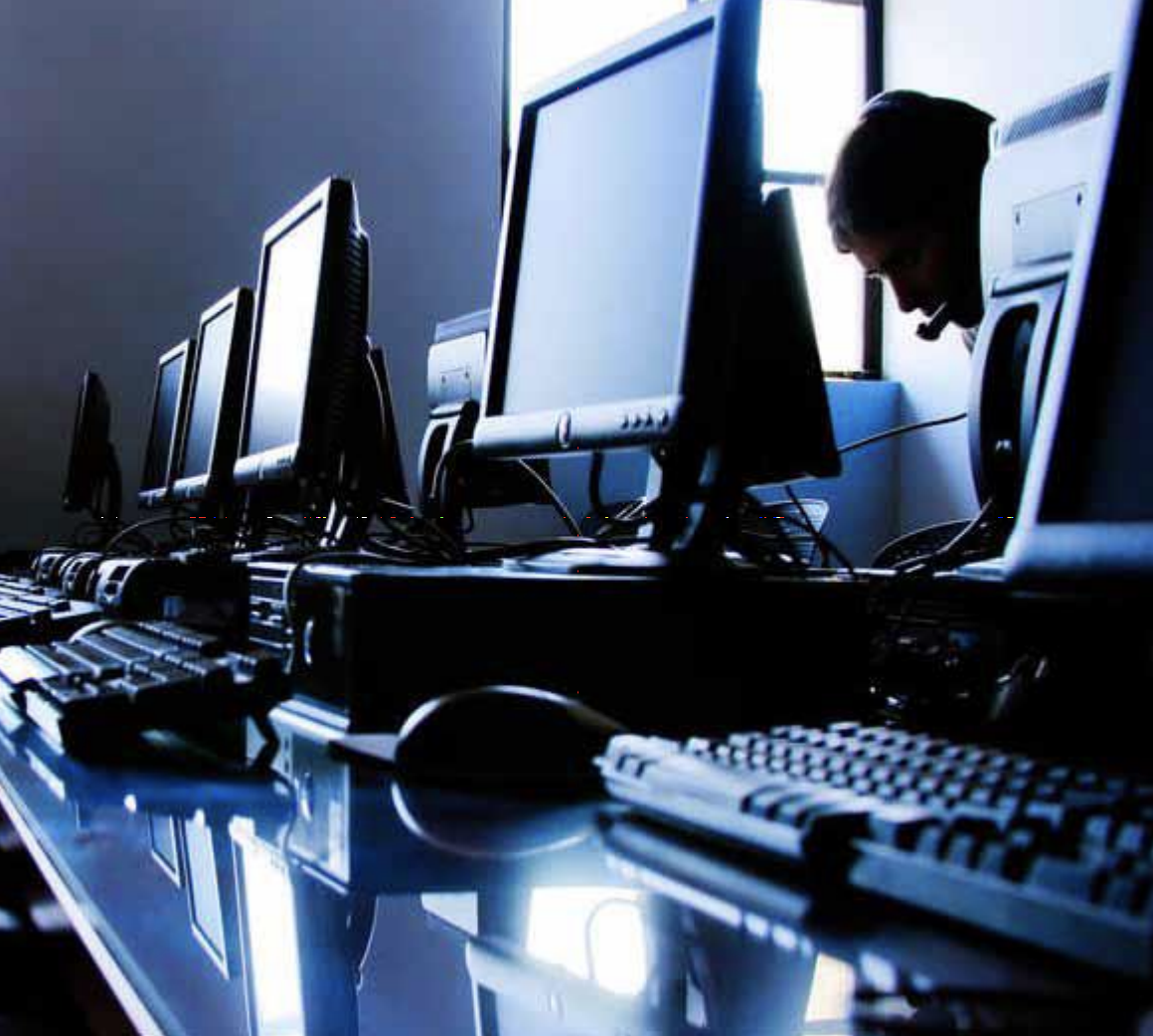 A row of computers on a table