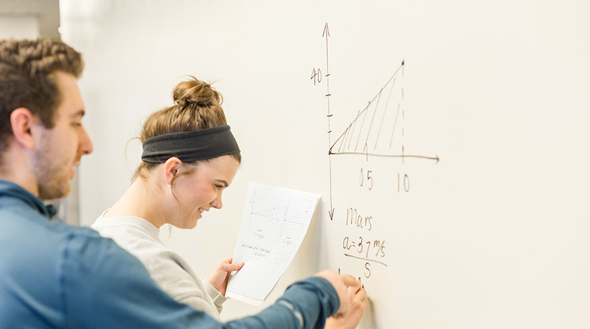 Students working on a physics problem