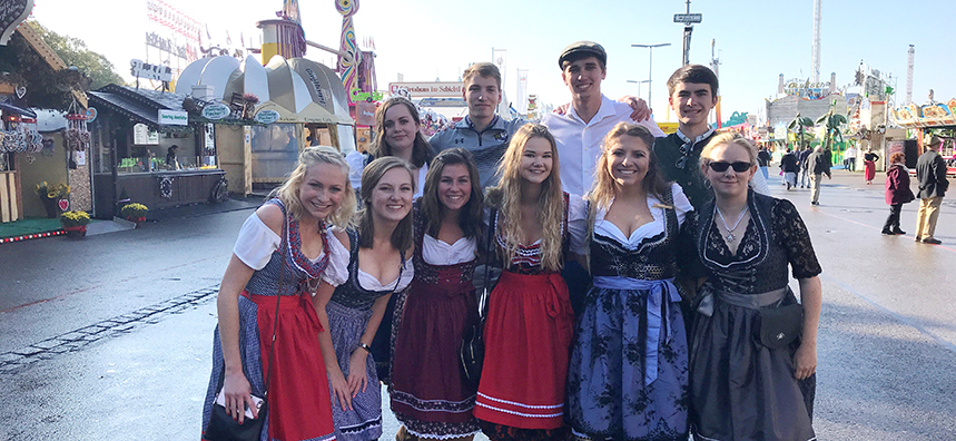 students dressed up at oktoberfest in leipzig, germany