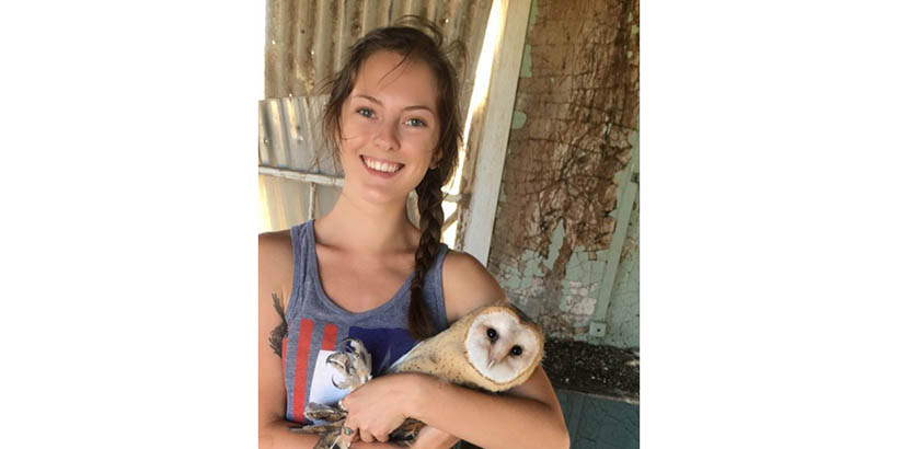 Julia Mello holding an owl
