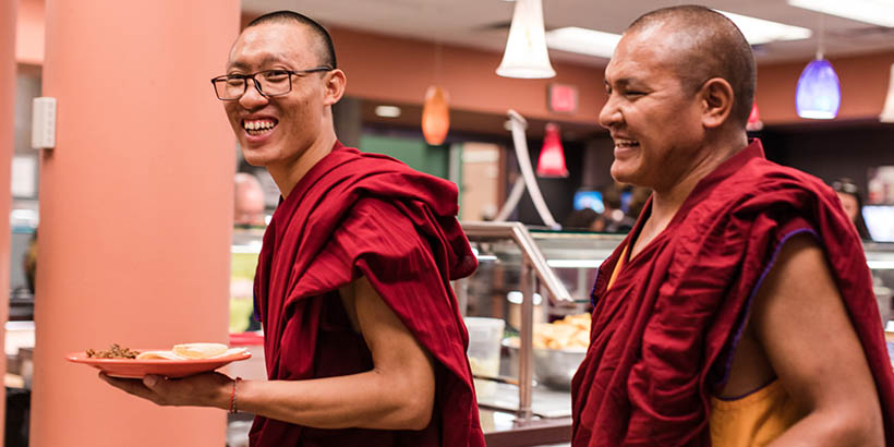 The Tibetan Monks getting food in Commons
