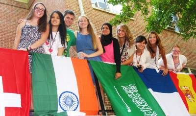 Students posing by Catawba flags