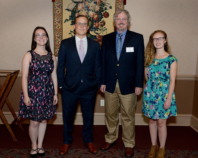 Alice Keith, Samuel McKnight and Chelsea Schafer with a professor 