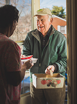 photo of George Kegley giving someone food