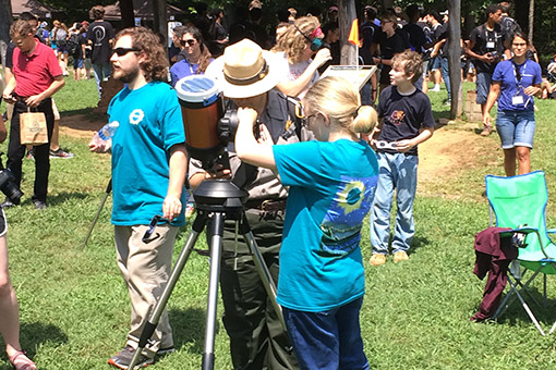 Park ranger viewing the eclipse at a point of totality 