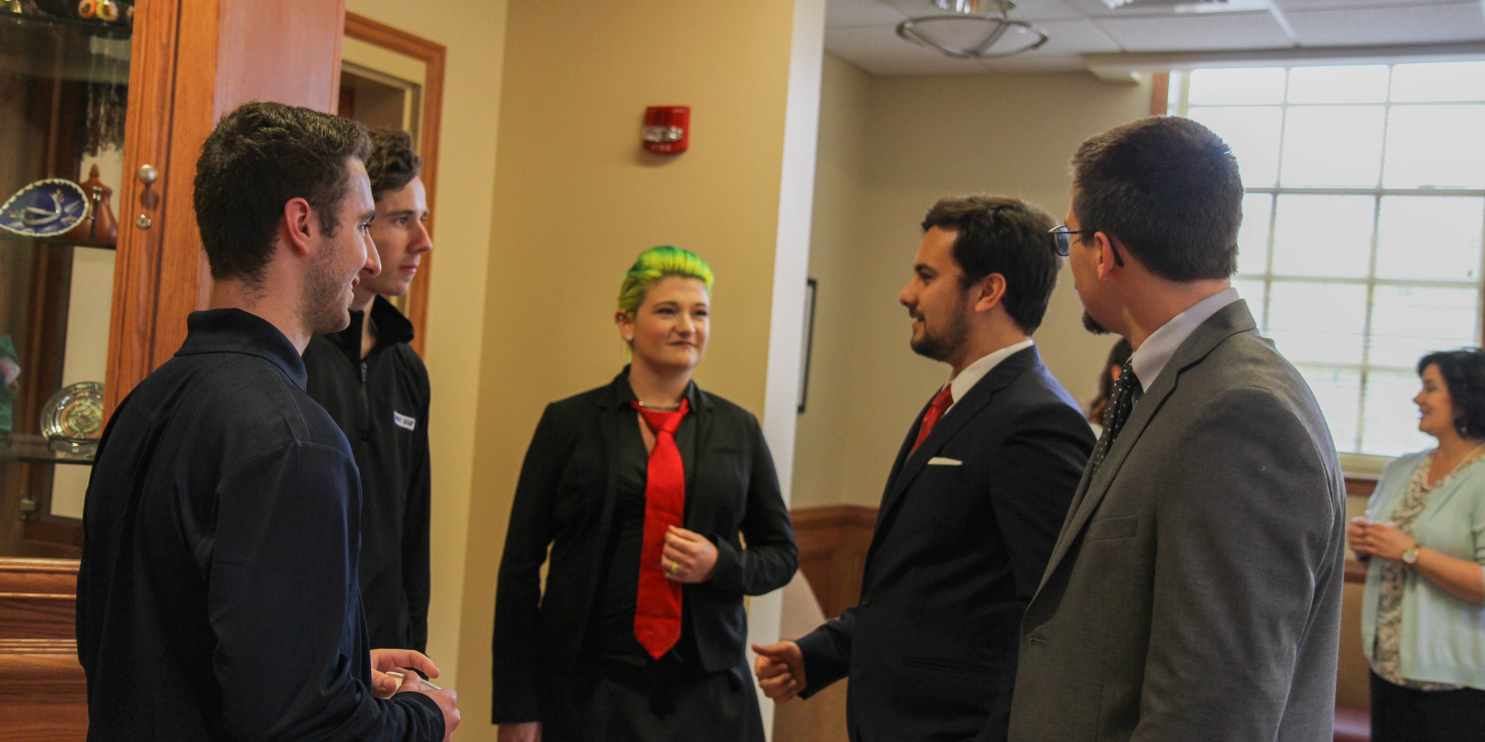 Finalists discuss their different ideas while waiting to hear the results. 