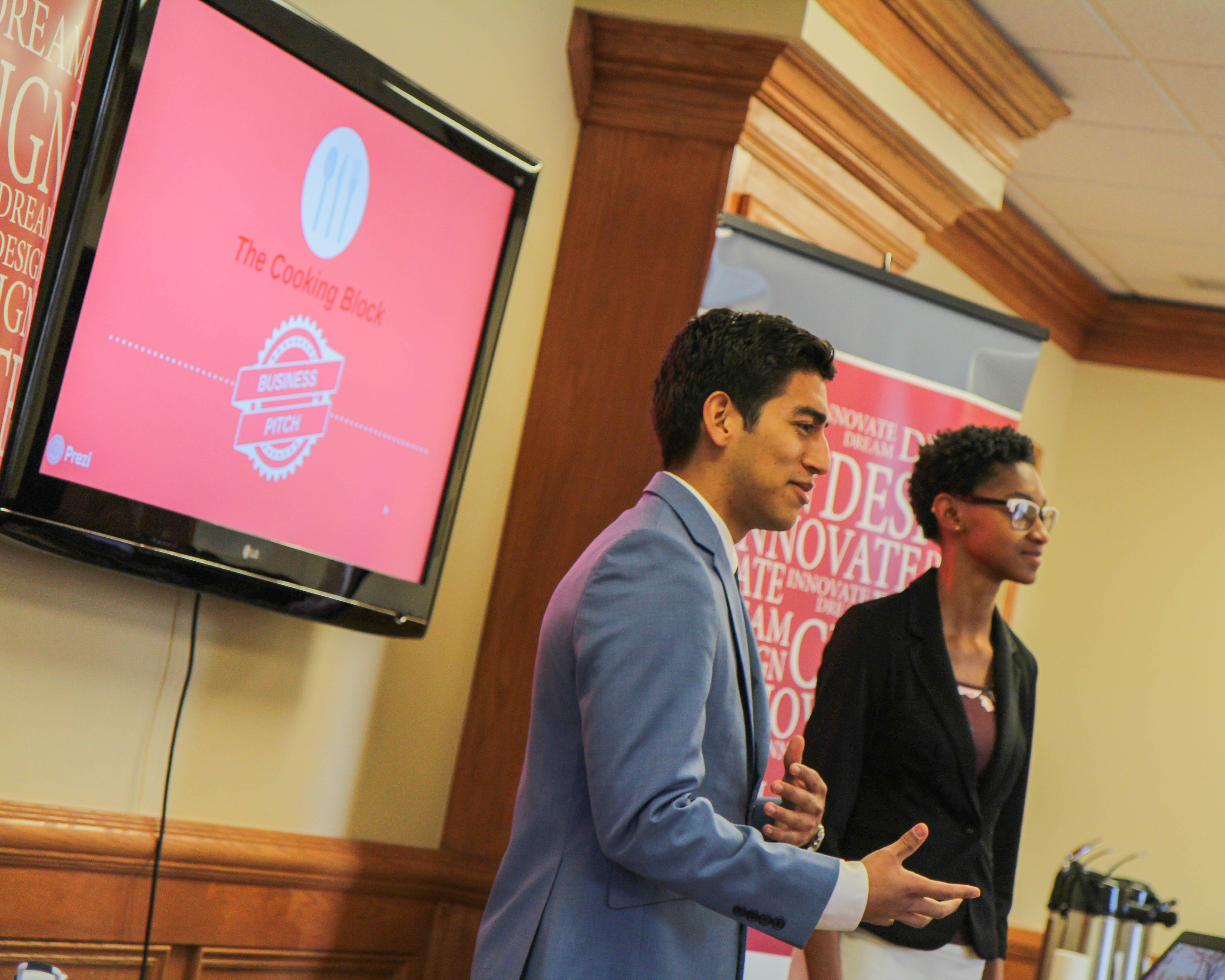 Brianna Manigault-King '20 and Frankchesco Leveratto '19 present their idea, Cooking Block, to the panel of judges.