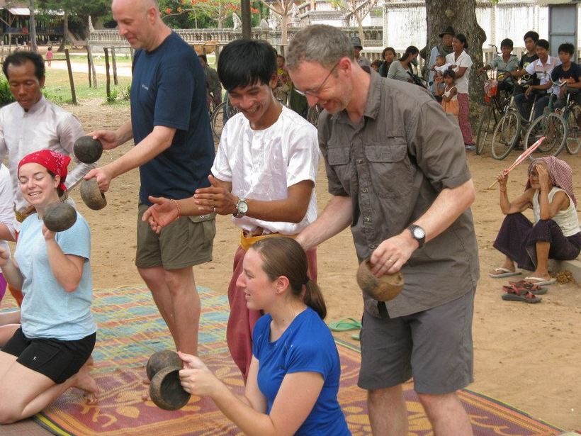 Students having fun with community members in Cambodia