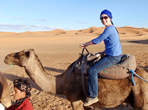 Photo of Katie Thornton on a camel
