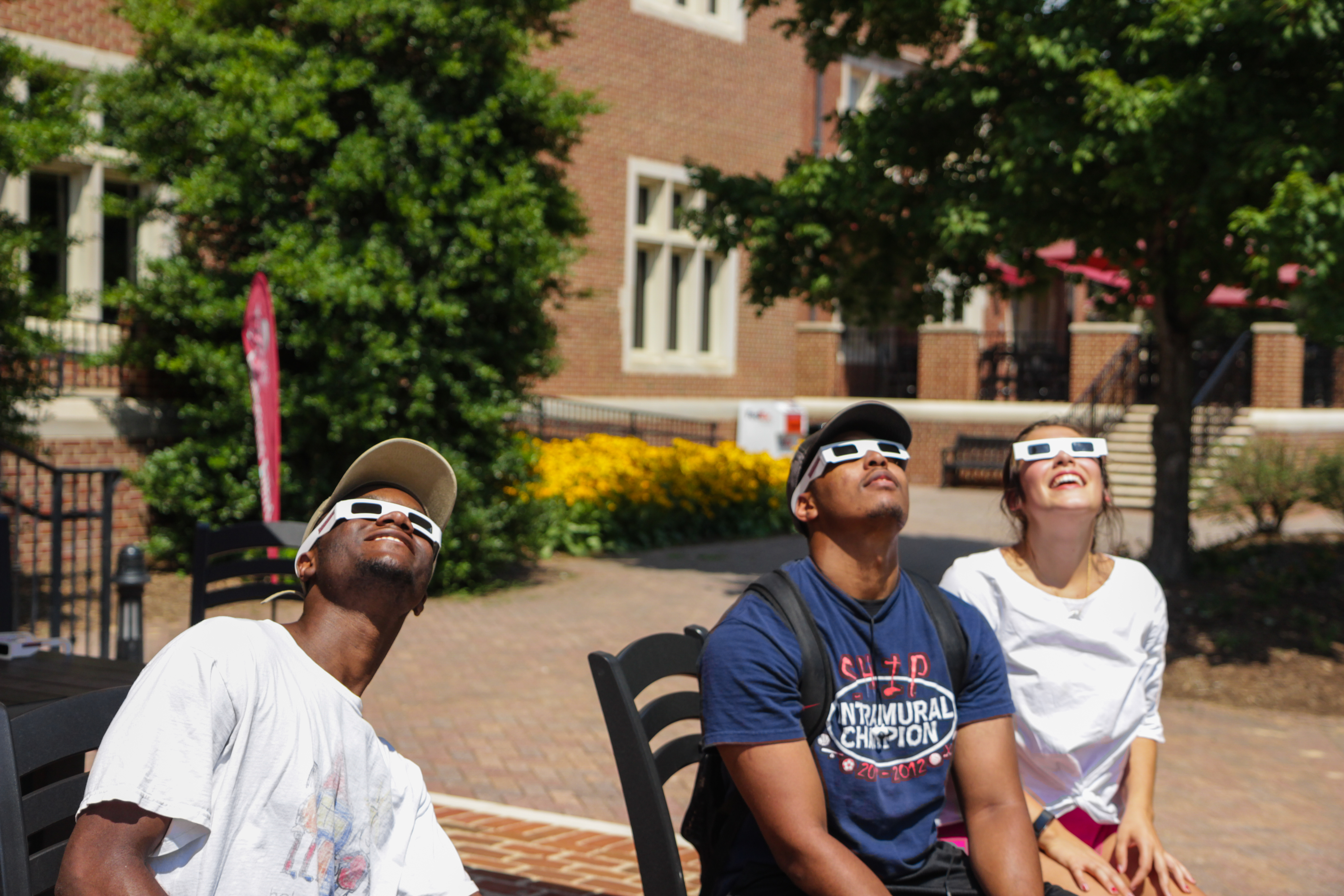 Students in front of Colket center watching eclipse