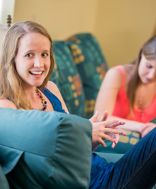 Honors students talking together in a lounge