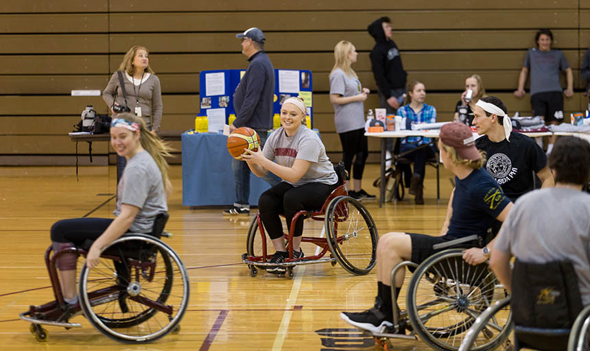 Students playing wheelchair basketball